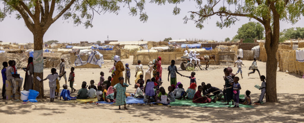 General View. Child-friendly Space. 
Adré Refugee Camp for Sudanese Displaced

In eastern Chad, thousands of Sudanese refugees seek safety in camps like Farchana and Adré, escaping the violent conflict between Sudan’s military and the Rapid Support Forces. In early May 2025, around 1,400 new refugees arrived daily across the region, straining overcrowded camps struggling to provide shelter, food, and medical care. UNICEF focuses on protecting children, who make up the majority of the displaced population. ©Reto Albertalli