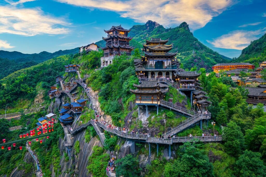 Beautiful ancient village with traditional wooden buildings on the green mountain in Jiangxi, China.; Shutterstock ID 2707601119; purchase_order: 33 reisen china sf; job: 31 reisen china sf; client: schweizer familie; other: